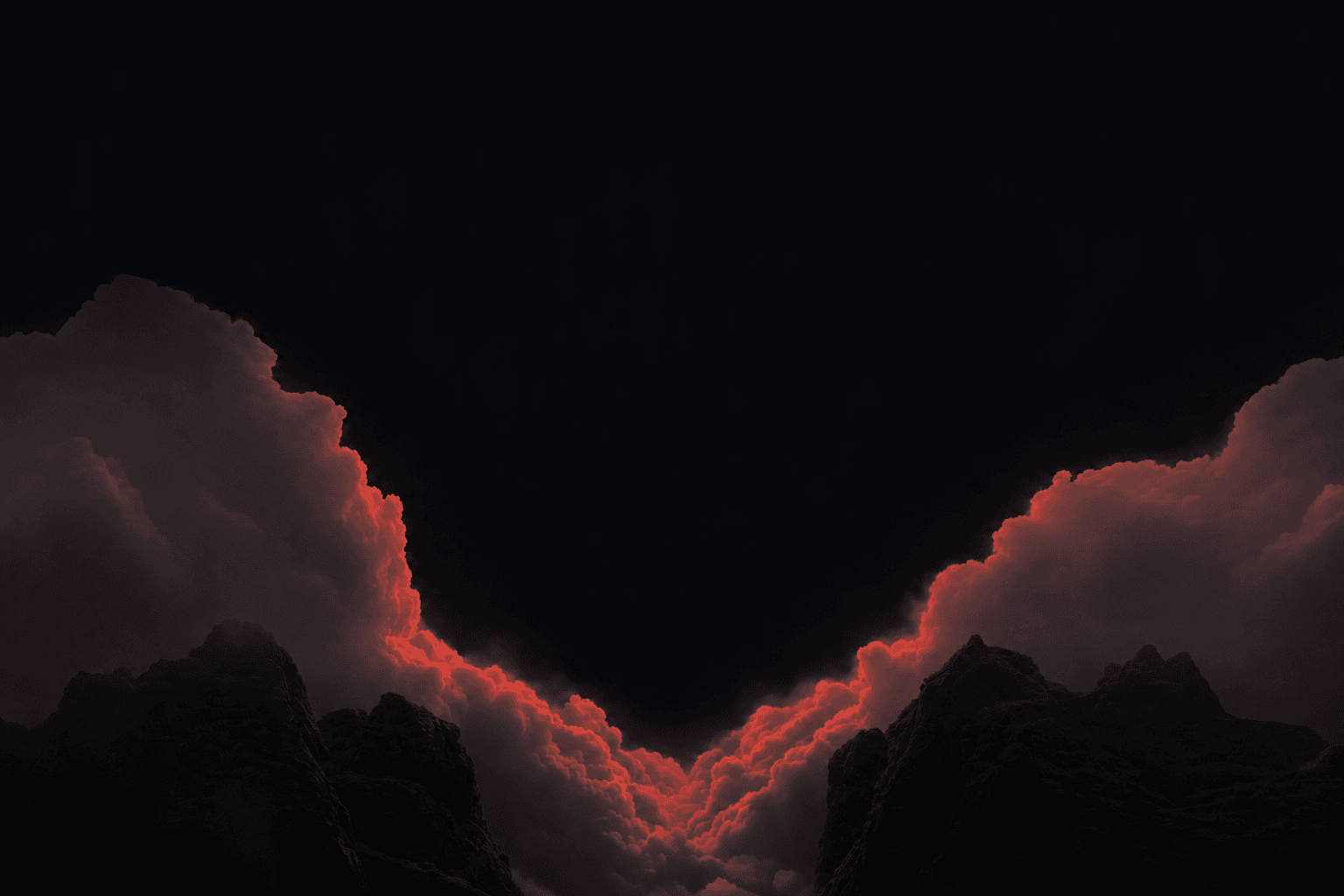 Red-lit clouds over a mountain valley